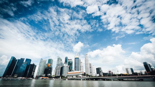 low-angle photography of building beside body of water during daytime