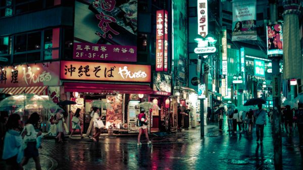 people walking near buildings at night